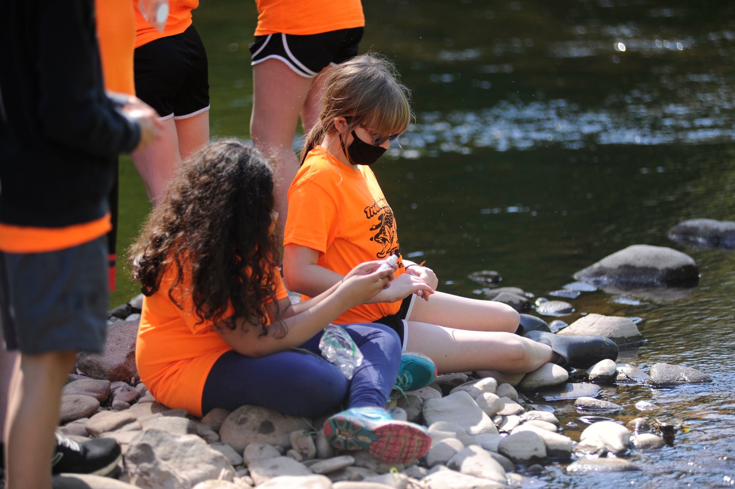 Testing the waters. Students tested the water quality of Callicoon Creek at one of the hands-on learning stations.